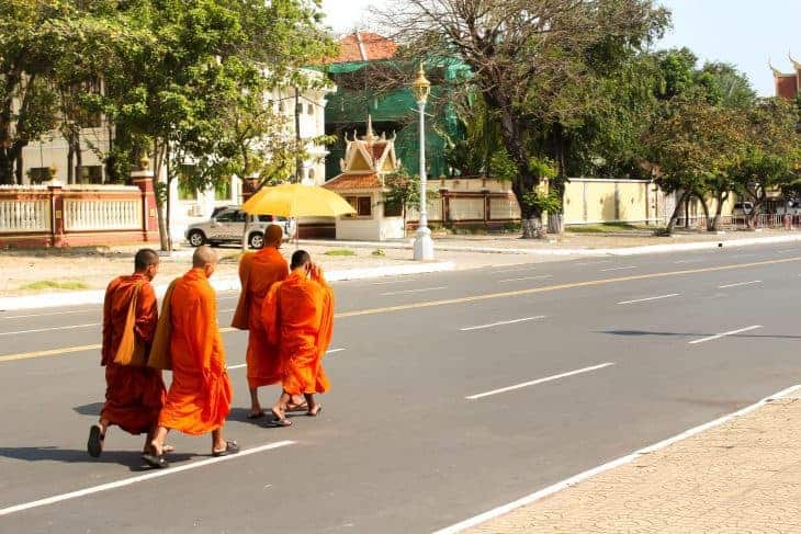 Monks crossing the road in Phnom Penh Cambodia